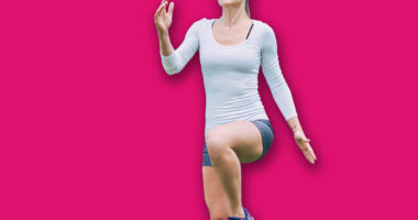 Athletic woman is training at an outdoor gym