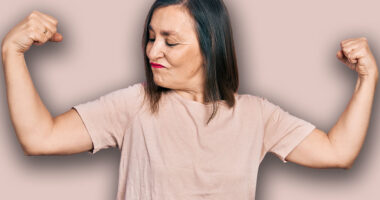 Middle age hispanic woman wearing casual clothes showing arms muscles smiling proud. fitness concept.