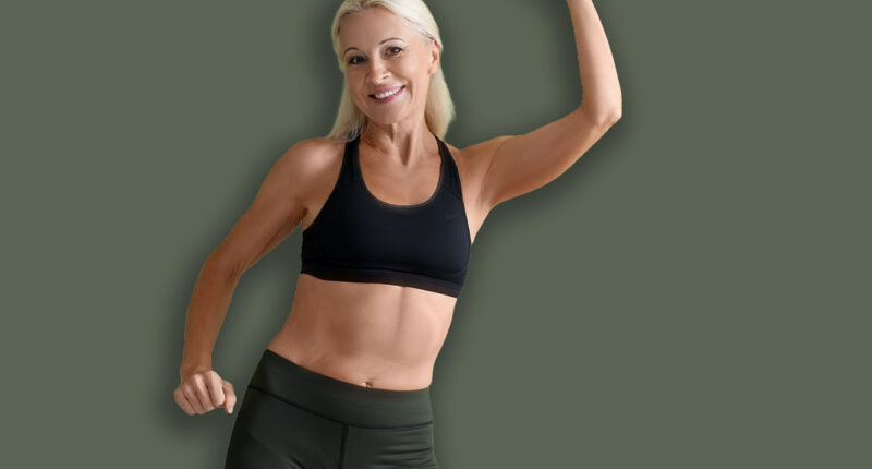 Sporty mature woman on green background