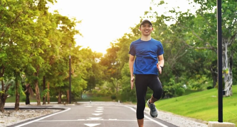 man walking doing high knees