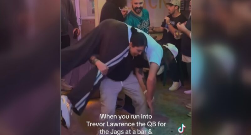 5'5" Jacksonville woman squats Trevor Lawrence at bar ahead of playoffs