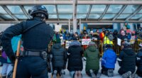 Anti-ICE agitators, including clergy, arrested at Minneapolis airport during protest in frigid weather