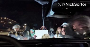 Anti-ICE agitators swarm vehicle of conservative influencer Nick Sortor