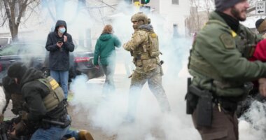 Tear gas is deployed as Federal agents make arrests on Wednesday, Jan. 21, 2026, in Minneapolis. (AP Photo/Angelina Katsanis)
