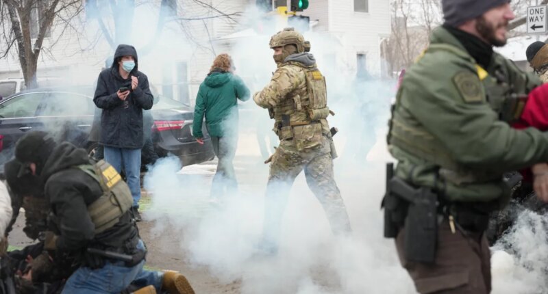 Tear gas is deployed as Federal agents make arrests on Wednesday, Jan. 21, 2026, in Minneapolis. (AP Photo/Angelina Katsanis)