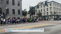 Anti-ICE protesters march down to City Hall