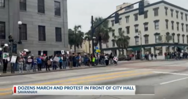Anti-ICE protesters march down to City Hall
