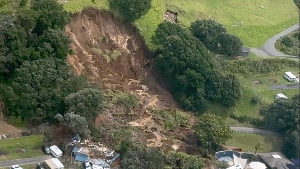 At least two dead in New Zealand landslides as video shows moment caravans are smashed at popular campsite where multiple children are missing