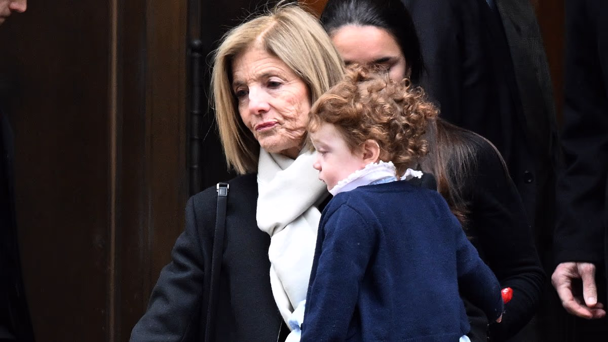 Caroline Kennedy holds granddaughter at Tatiana Schlossberg's funeral
