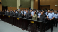 A Chinese court sentencing 11 people to death for running a family-run criminal empire in Myanmar and for killing workers who tried to escape in Zhejiang, China on September 29, 2025.