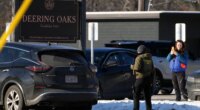 A woman films a Homeland Security Investigations agent at a parking lot at Deering Oaks Park, Friday, Jan. 23, 2026, in Portland, Maine.(AP Photo/Robert F. Bukaty)