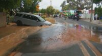 A couple's drive to the airport has taken a shocking turn after their hire car fell into a large sinkhole in Adelaide.