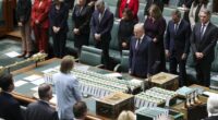 Prime Minister Anthony Albanese and Members of the House of Representatives observe a minutes silence as a mark of respect during a condolence motion in relation to the victims of the Bondi antisemitic terror attack, in the House of Representatives at Parliament House in Canberra on Monday 19 January 2026.