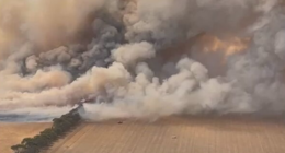 Evacuees told 'don't go home' as bushfire warnings downgraded