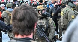 Heavily armed ICE agents face off with protesters in Minnesota.