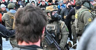 Heavily armed ICE agents face off with protesters in Minnesota.