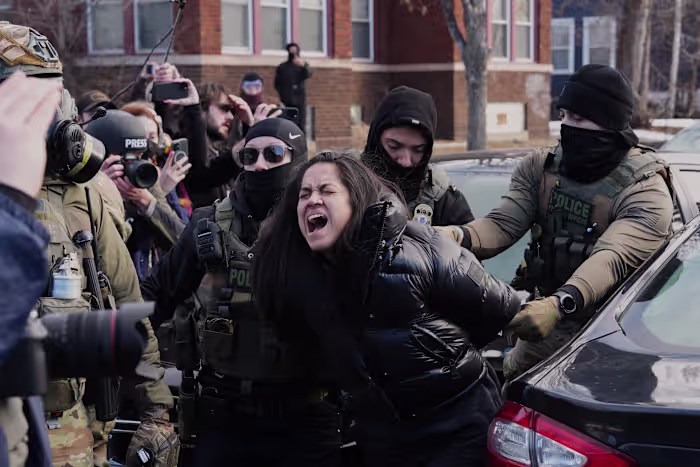 Federal immigration agents filmed dragging a woman from her car in Minneapolis