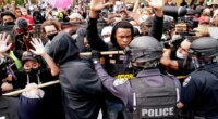FILE - Police and protesters converge during a demonstration, Wednesday, Sept. 23, 2020, in Louisville, Ky. Recent revelations about the search warrant that led to Breonna Taylor