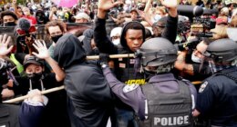 FILE - Police and protesters converge during a demonstration, Wednesday, Sept. 23, 2020, in Louisville, Ky. Recent revelations about the search warrant that led to Breonna Taylor