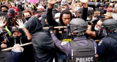 FILE - Police and protesters converge during a demonstration, Wednesday, Sept. 23, 2020, in Louisville, Ky. Recent revelations about the search warrant that led to Breonna Taylor