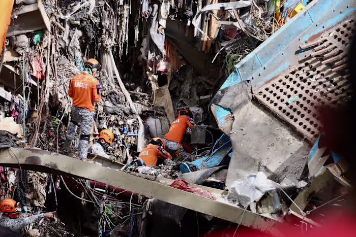 Filipino rescuers detect 'signs of life' in garbage avalanche that killed 4 and left dozens missing