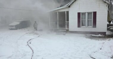 Firefighters battle early morning fire in Arthur, rescue 2 cats