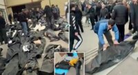 Footage shows grieving families in Iran wailing and desperately searching through rows of dead of bodies for loved ones
