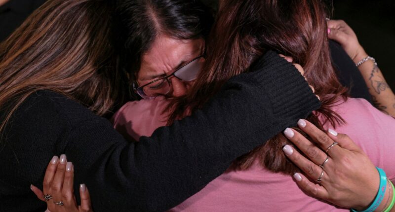 Mothers of Robb Elementary School shooting victims, from left, Sandra Torres, Veronica Luevanos, and Felicha Martinez cry together outside the Nueces County Courthouse on Wednesday, Jan. 21, 2026, in Corpus Christi, Texas, after former Uvalde school district police officer Adrian Gonzales was found not guilty. (Sam Owens/The San Antonio Express-News via AP, Pool)
