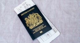 London, United Kingdom - March 7th, 2023 :   A new blue British passport with an airline boarding pass.  Since the United Kingdom has left the European Union in 2020, new British passports have returned to their original blue colour.