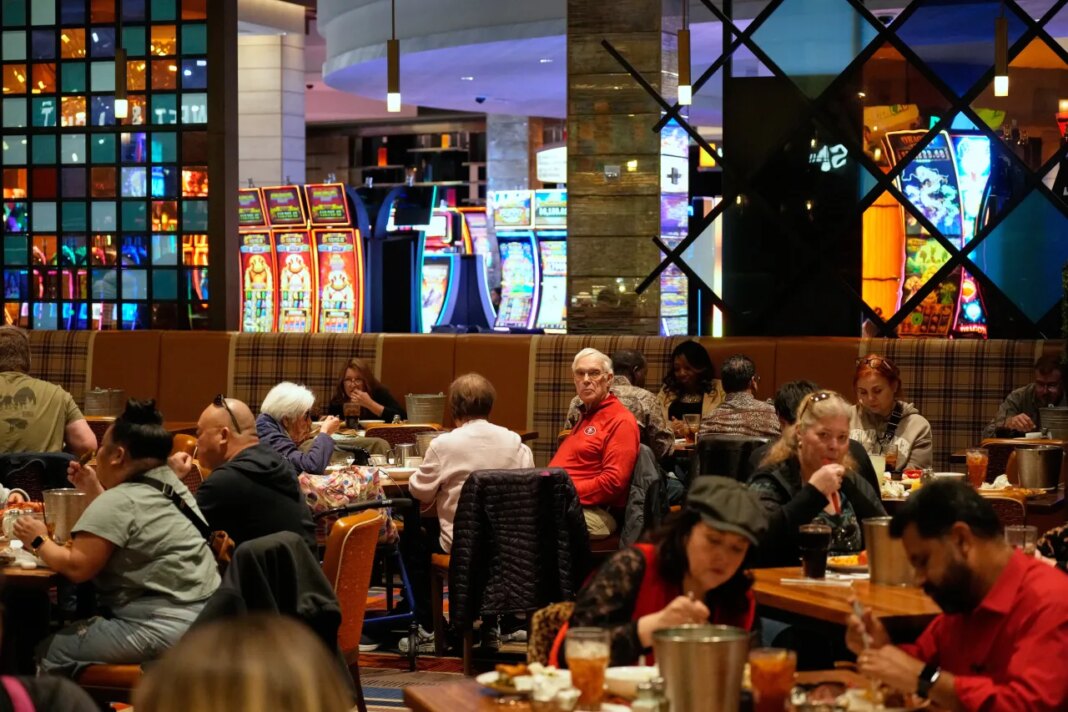 People eat at the A.Y.C.E Buffet in the Palms resort-casino Wednesday, Jan. 28, 2026, in Las Vegas. (AP Photo/John Locher)