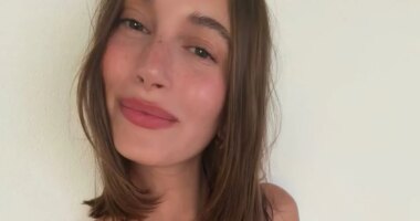 Hailey Bieber Flaunts Her Washboard Abs in a Strappy Leopard-Print Swimsuit