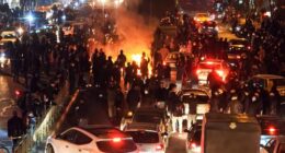 People gather during protest on January 8, 2026 in Tehran, Iran. Demonstrations have been ongoing since December, triggered by soaring inflation and the collapse of the rial, and have expanded into broader demands for political change.
