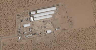 FILE - This Aug. 7, 2025, satellite image shows construction of large white tents for a new immigrant detention center at Fort Bliss, a U.S. Army base outside El Paso, Texas. (Planet Labs via AP, File)