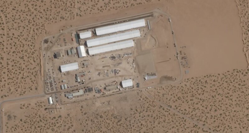 FILE - This Aug. 7, 2025, satellite image shows construction of large white tents for a new immigrant detention center at Fort Bliss, a U.S. Army base outside El Paso, Texas. (Planet Labs via AP, File)