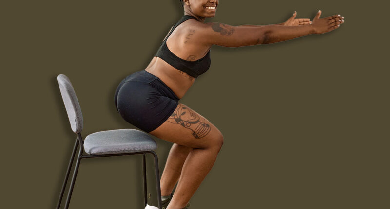 Young african american couple training using chair at sport center.