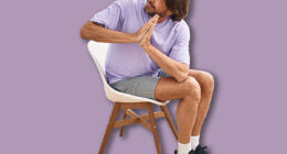 Middle age man smiling confident sitting on chair stretching at sport center