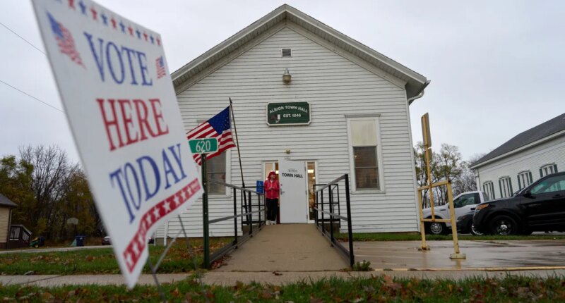 FILE - A voter leaves Albion Town hall after casting their ballot on Election Day, Nov. 5, 2024, in Albion, Wis. (AP Photo/Kayla Wolf, File)