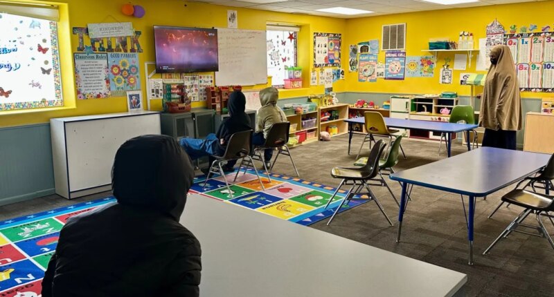 FILE - Children watch television at ABC Learning Center in Minneapolis, Minn., Dec. 31, 2025. (AP Photo/Mark Vancleave, File)