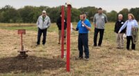 FILE - NioCorp Chief Operating Officer Scott Honan tells a group of investors about the plans for a proposed mine during a tour of the site Oct. 6, 2021, near Elk Creek in southeast Nebraska. (AP Photo/Josh Funk, File)