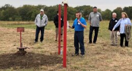 FILE - NioCorp Chief Operating Officer Scott Honan tells a group of investors about the plans for a proposed mine during a tour of the site Oct. 6, 2021, near Elk Creek in southeast Nebraska. (AP Photo/Josh Funk, File)