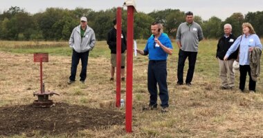 FILE - NioCorp Chief Operating Officer Scott Honan tells a group of investors about the plans for a proposed mine during a tour of the site Oct. 6, 2021, near Elk Creek in southeast Nebraska. (AP Photo/Josh Funk, File)
