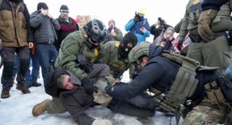 Minneapolis protesters confront federal agents day after deadly shooting