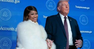 President Donald Trump greets Nicki Minaj during the event "Trump Accounts" at the Andrew W. Mellon Auditorium, Wednesday, Jan. 28, 2026, in Washington.