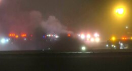 This image taken from video provided by WABI television, emergency cervices work on a scene of the Bombardier Challenger 600 crash at the Bangor Airport in Maine, late Sunday, Jan. 25, 2026. (WABI via AP)