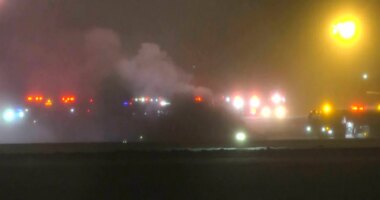 This image taken from video provided by WABI television, emergency cervices work on a scene of the Bombardier Challenger 600 crash at the Bangor Airport in Maine, late Sunday, Jan. 25, 2026. (WABI via AP)