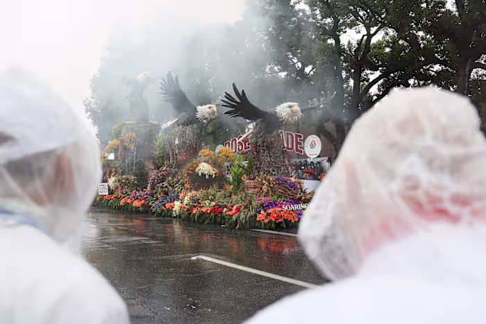 Rain soaks Rose Parade in California and snow squalls hit Midwest and Northeast on first day of 2026