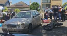 A damaged Mercedes-Benz that collided with an e-bike in Sydney's eastern suburbs.