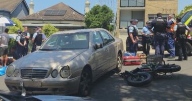 A damaged Mercedes-Benz that collided with an e-bike in Sydney's eastern suburbs.