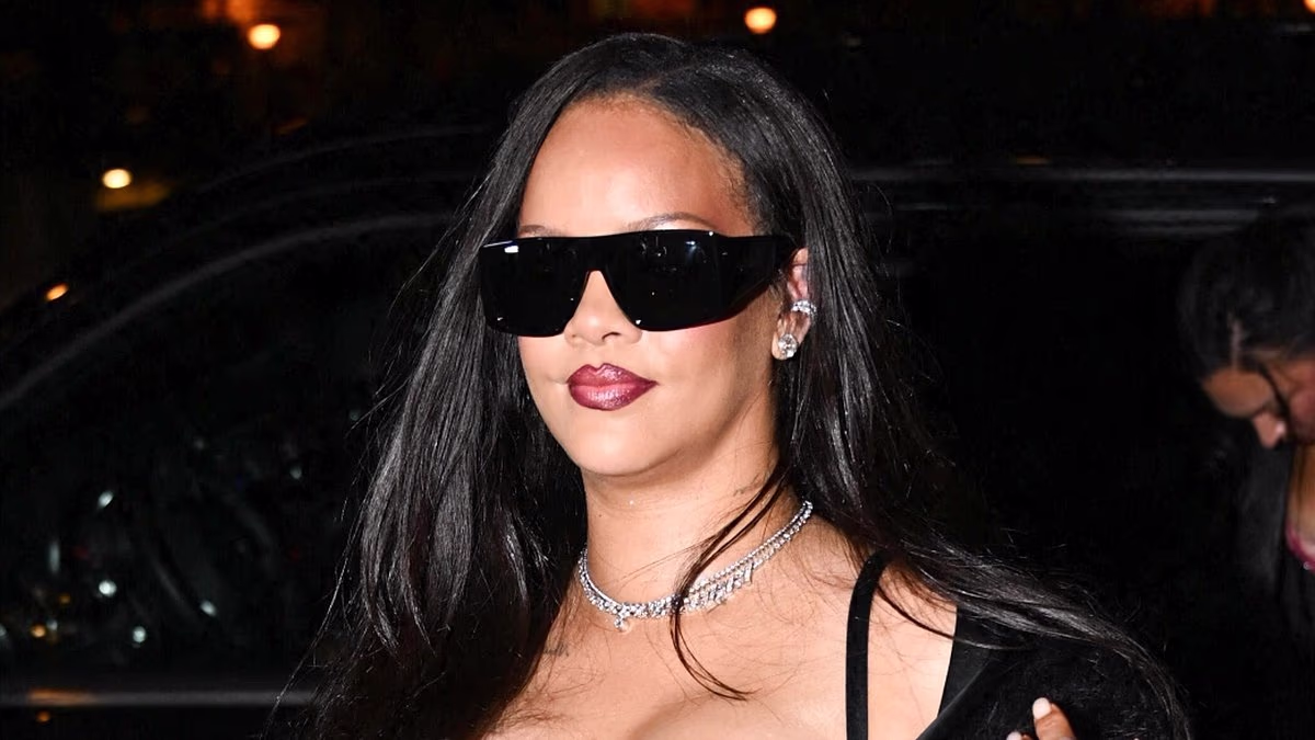 Rihanna unleashes her bombshell side in a curve-hugging black dress