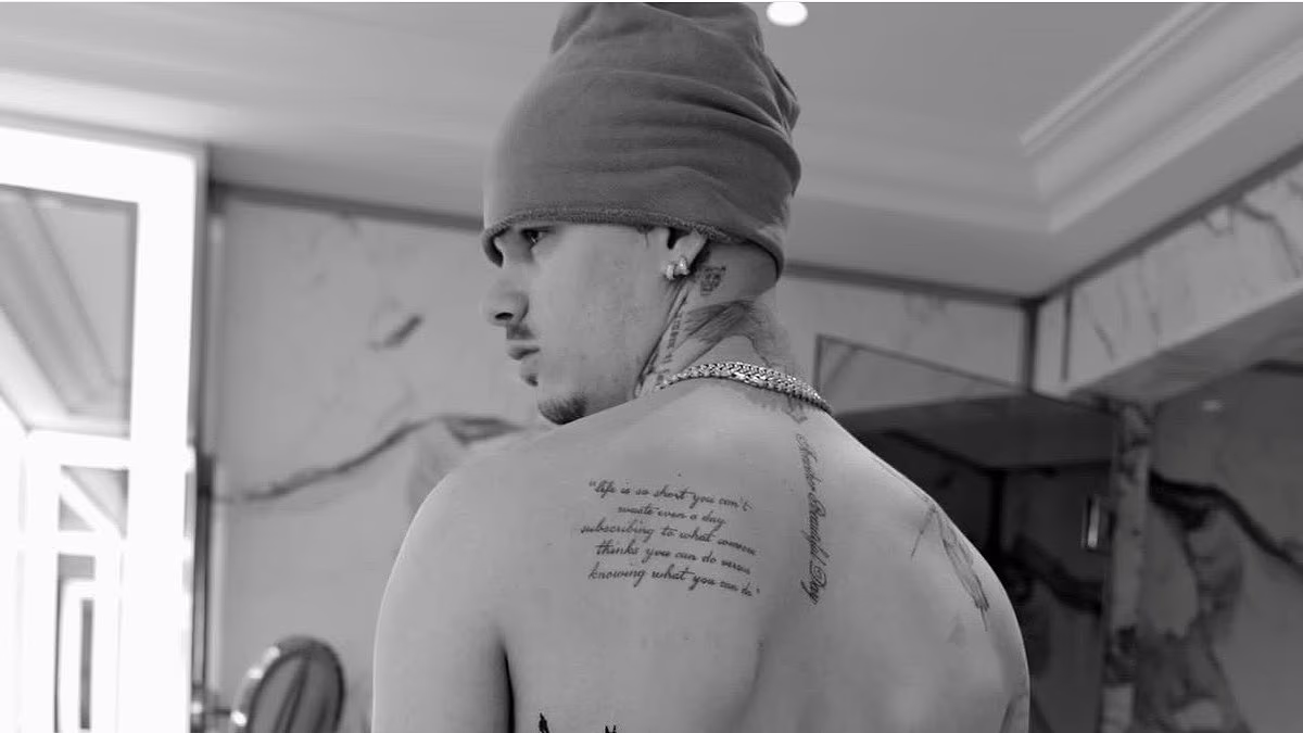 Romeo Beckham unveils a new tattoo as his family close ranks